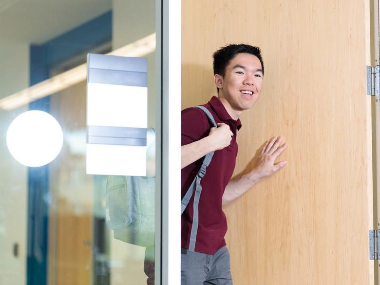 student walking in the door