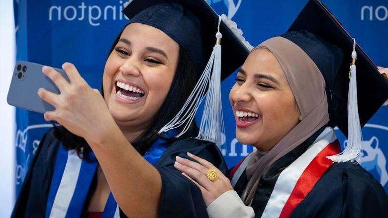 Two new Penn State Abington graduates take a selfie